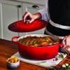 Kastrol SIGNATURE 29 cm, 4,7 l, oválný, CERISE, litina, Le Creuset